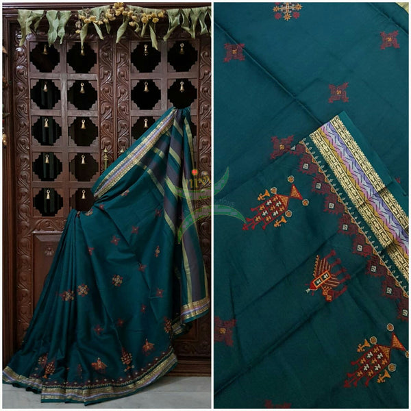 Teal Kota cotton saree with kasuti embroidery. Saree is woven with zari border and striped pallu.