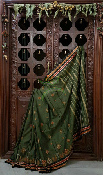 Grey shot green Kota cotton saree with kasuti embroidery. Saree is woven with black contrasting border and striped pallu.