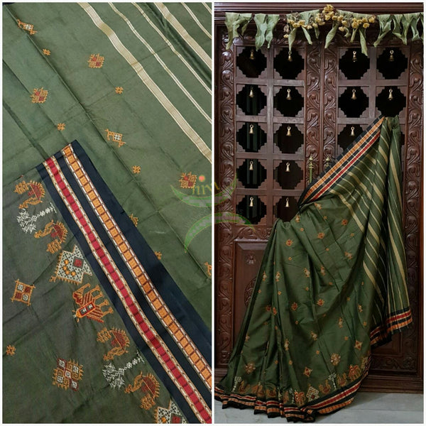 Grey shot green Kota cotton saree with kasuti embroidery. Saree is woven with black contrasting border and striped pallu.