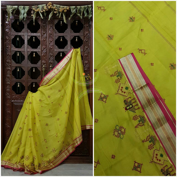 Neon yellow Kota cotton saree with kasuti embroidery. Saree is woven with zari border and striped pallu.