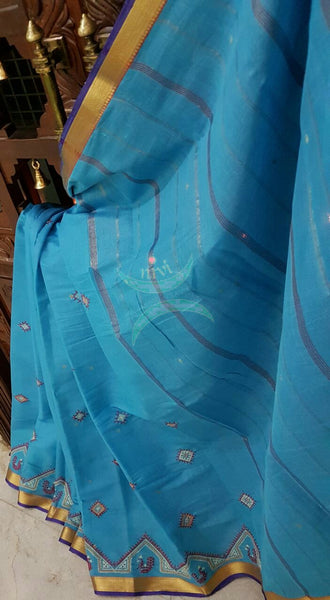 Bottle green Kota cotton saree with kasuti embroidery. Saree is woven with zari border and striped pallu.