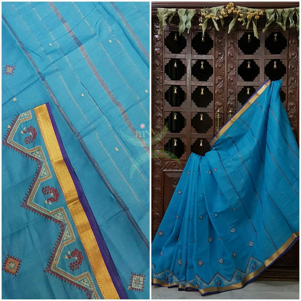 Bottle green Kota cotton saree with kasuti embroidery. Saree is woven with zari border and striped pallu.
