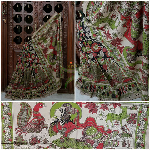 Black mul cotton kalamkari with intricate floral and peacock motif on body of the saree, human figure motif on the pallu and  floral motif on the border.