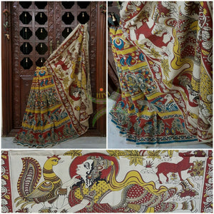 Red mul cotton kalamkari with intricate floral, human figure and peacock motif.