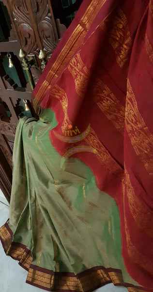 Grey shot green with maroon Dharwad mercerized cotton saree with traditionally woven border and pallu.