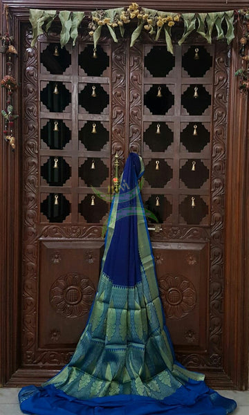 Blue Art silk crepe with woven zari border and pallu.