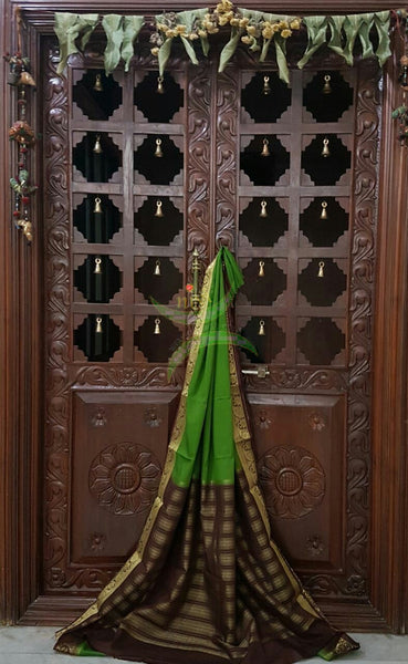 Green with Brown Art silk crepe with woven zari border and pallu.