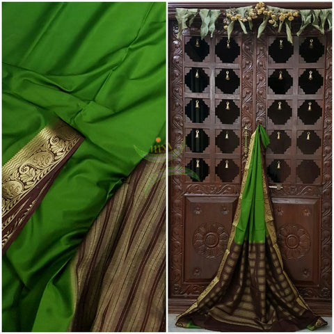 Green with Brown Art silk crepe with woven zari border and pallu.