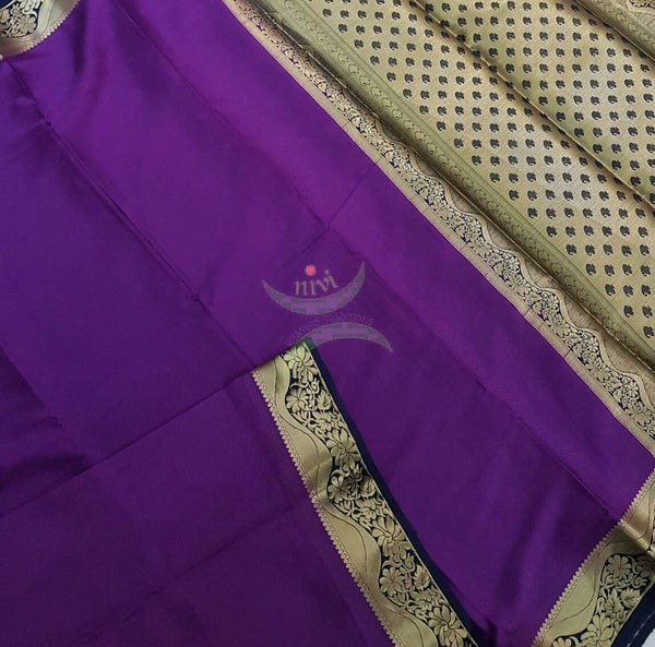 Purple with Navy blue Art silk crepe with woven zari border and pallu.