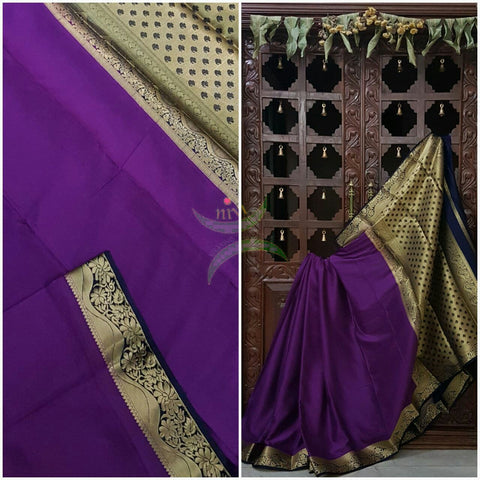 Purple with Navy blue Art silk crepe with woven zari border and pallu.