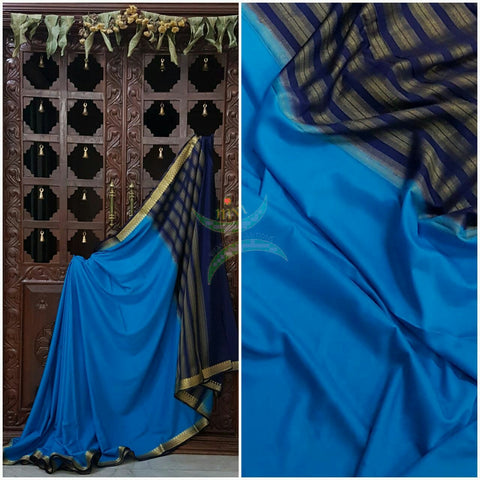 Blue with Navy blue Art silk crepe with woven zari border and pallu.