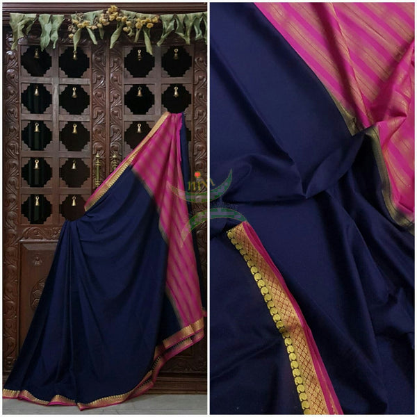 Navy blue with pink Art silk crepe with woven zari border and pallu.