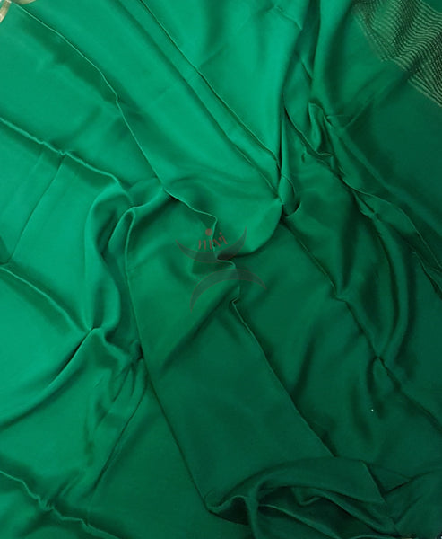 Two tone Bottle green 40 gms pure silk crepe. Saree comes with lighter shade silk crepe blouse piece.