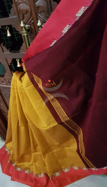 Mustard Handloom merserised soft cotton saree with contrast orange border with woven zari. saree comes with maroon pallu and blouse.