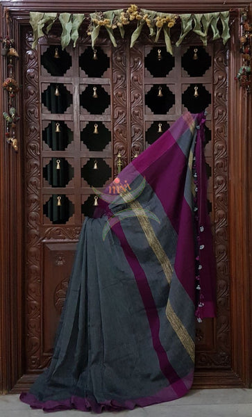 Handloom linen blend saree with contrast border and pallu.