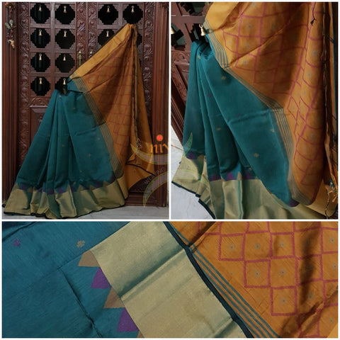 Teal with mustard handloom merserised cotton with benarsi zari border and woven botties all over the saree.