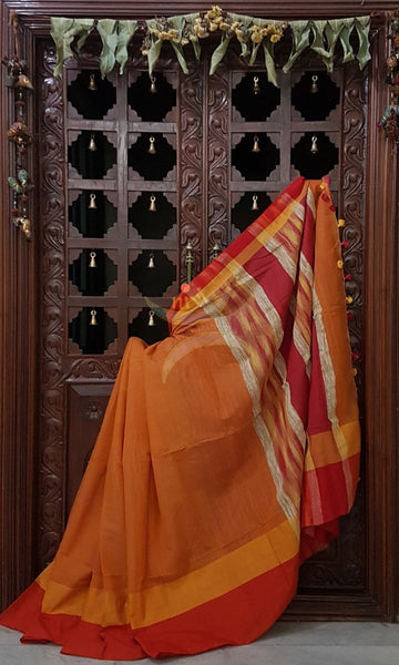 Orange handloom cotton with contrasting red orange border and Geecha pallu