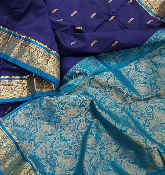 Royal blue with blue small Ghatti border pure south silk saree woven with floral brocade pattern on pallu and border. Saree has paisley drop booties all over.