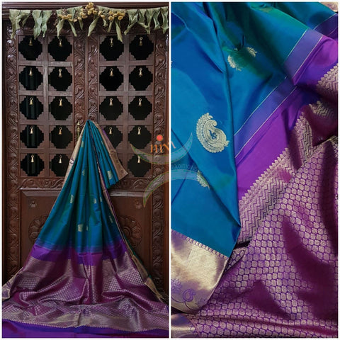 Teal with pink handloom pure kanjivaram  silk saree woven with paisley booties all over the saree and  brocade pattern on pallu and border.