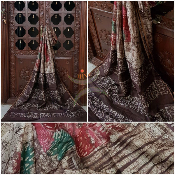 Off white with brown Handloom pure tussar silk with batik print woven with fine zari lines.