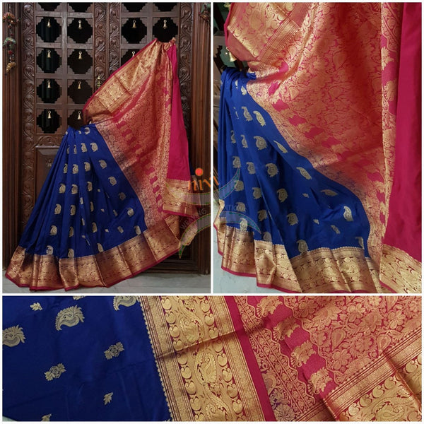 Royal blue with pink pure south silk saree woven with paisley and floral brocade pattern on pallu, border and has paisley and floral booties all over.