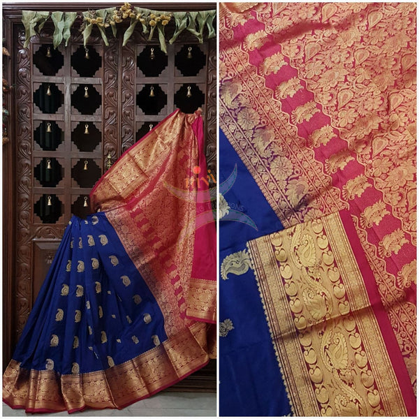 Royal blue with pink pure south silk saree woven with paisley and floral brocade pattern on pallu, border and has paisley and floral booties all over.