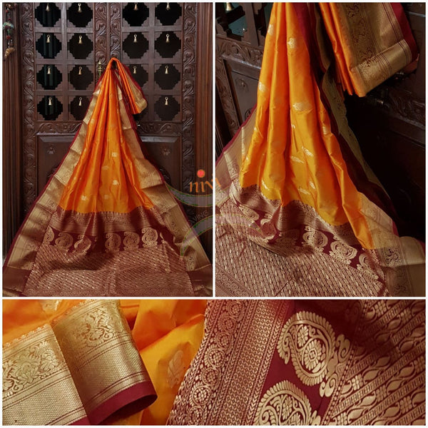 Mustard with maroon pure south silk saree woven with paisley and floral brocade pattern on pallu, border and has paisley and floral booties all over.