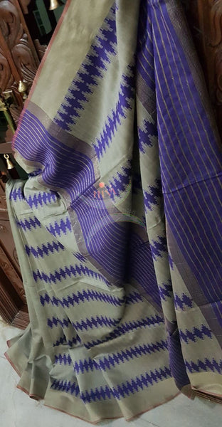 Grey Bengal Handloom cotton with self woven vertical lines all over the saree with Geecha pallu. Saree comes with woven striped blouse . 
