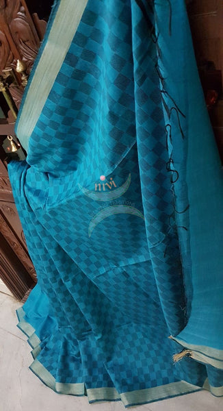 Turquoise blue  half and half Bengal Handloom cotton with woven checks and plain with striped pallu. Saree comes with plain blouse . 