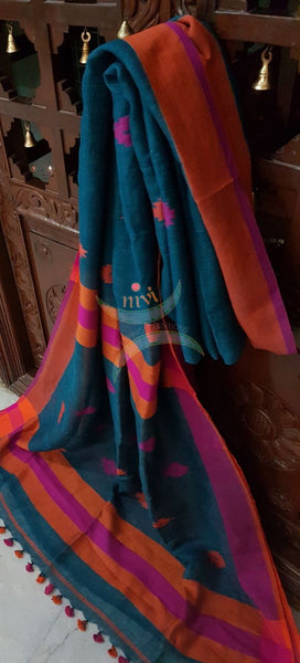 Teal Handloom 100s count Linen saree with woven floral booties all over the saree and contrasting rust orange pink border and pallu.