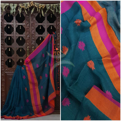 Teal Handloom 100s count Linen saree with woven floral booties all over the saree and contrasting rust orange pink border and pallu.