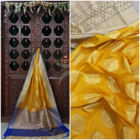 Yellow with blue benarsi brocade duppata with woven zari booties all over.