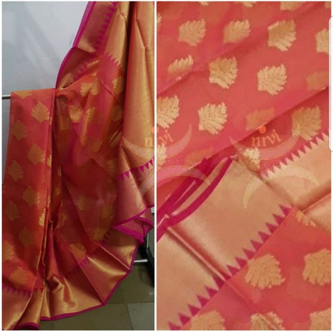 Dark peach cotton blend benaras brocade with antique zari motif on body, pallu and temple border. The saree comes with blouse piece matching pallu.