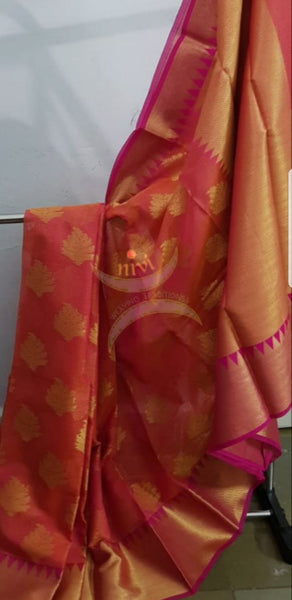 Dark peach cotton blend benaras brocade with antique zari motif on body, pallu and temple border. The saree comes with blouse piece matching pallu.